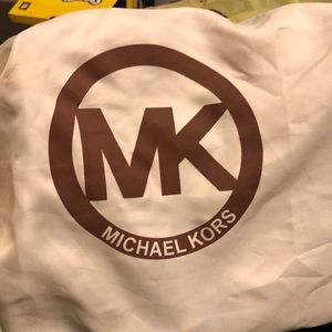 Brown/tan shoulder bag, large compartments inside